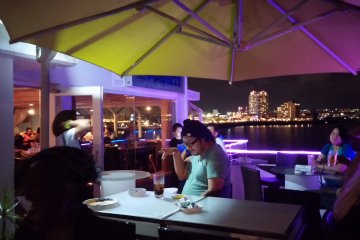 <p>Seating area and dinner tables on the outdoor patio</p>