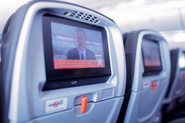 <p>The flight's instructional safety video is brought to all passengers by the seat back entertainment system</p>