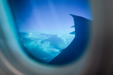 <p>Dimmed views appear cool blue through the cabin windows</p>