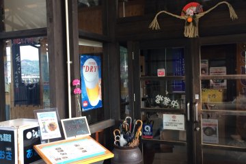 <p>Your attention is taken to the shimenawa new year charm at the entrance door. This provincial custom dates back to Edo period in the 17th century, when the shogun oppressed Christians in Amakusa. The townsfolk was forced to declare their allegiance to Shintoism by decorating their front doors with shimenawa.</p>