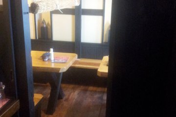 <p>The inside of the restaurant is a pleasant mixture of dark and light wood.</p>