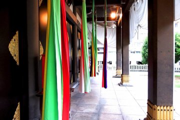 <p>Colorful strips hanging from the eaves</p>