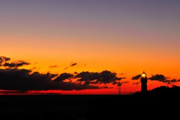 <p>Shiono Point Lighthouse at sunset. Shiono Point is the tip of Kii Peninsula, and you can enjoy the sunset here, and sunrise in Kushimoto, the neighboring town</p>
