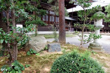 <p>Small Japanese garden and temple buildings</p>