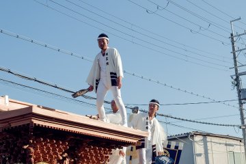 The daikugata (carpenter) stands bravely atop each float