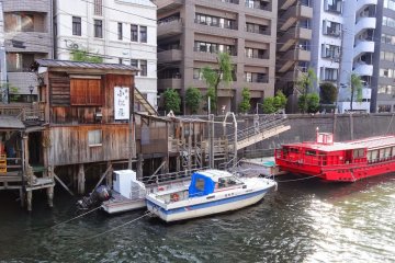 <p>Old wooden shack at Yanagibashi Bridge</p>