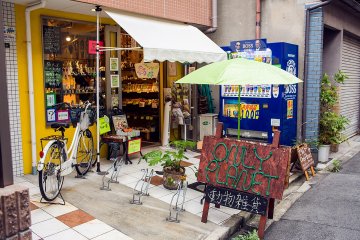 <p>Only Planet's shopfront has a creative sandwich board sign with lettering made from cord</p>