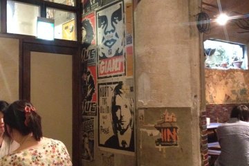 <p>Distressed posters and exposed walls equal effortless cool</p>