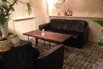 <p>Plush sofas in the back room, available for party bookings</p>