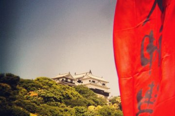 Above it all, the castle stands serenely tranquil.