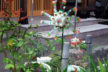 <p>Curious handmade plastic windmill on the temple grounds, probably to ward off animals</p>