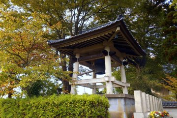 <p>Belfry surrounded by yellow trees</p>