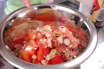 <p>Myoga (Japanese ginger), tomato, onion, and sesame oil are swirled together for a seasonal chilled tofu topper.</p>