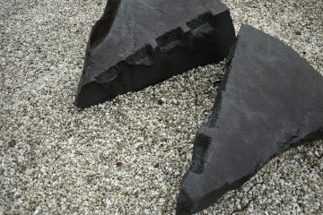 <p>A split stone showing grooves that once held wooden dowels</p>