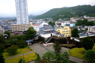 <p>JR Chuo line runs along this side of the castle.</p>