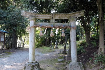 <p>The stone torii gate stands at the entrance of 'Thirty-three Kannon Bosatsu' pilgrimage path in the woods</p>