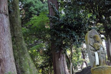 <p>Statue Number twenty-six has yellow moss on its body</p>