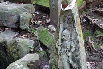 <p>Fudo Myo-O statue stands at the foot of 'Thunder Pond'</p>