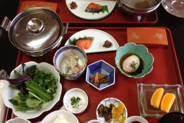 <p>Breakfast, including onsen egg and local new rice. &nbsp;On the left, the dish of green vegetables and the silver pot were for a "vegetable&nbsp;shabu shabu&nbsp;"&nbsp;</p>