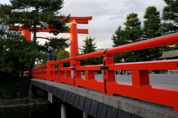 <p>Big red torii and bridge over the canal</p>