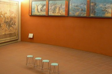 <p>The wall color enhances the art</p>