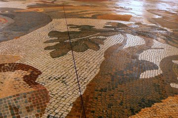 <p>The mosaics are displayed on the floor and you can walk over them as the original owners would have done</p>