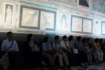 <p>Listening to a short lecture in the Sistine Chapel room</p>