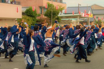 <p>Dancers fill the streets</p>