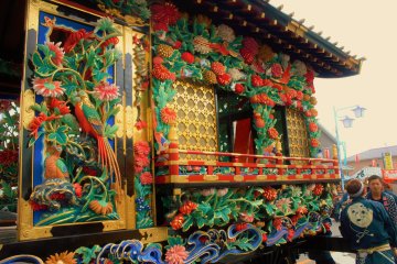 <p>While most floats are detailed carvings, this float stands proud in a rainbow of painted colors</p>