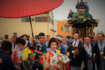 <p>The parade fills the street</p>