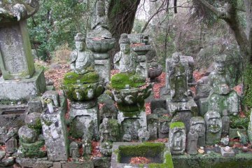 Many statues sit alone, but others are gathered in groups.
