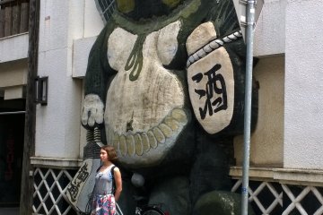 <p>Another funky izakaya, the tanuki figure is to attract people to such places.</p>