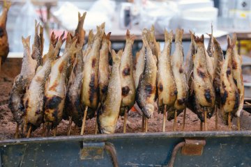 <p>Grilled fish on a stick were being sold on a handful of stalls.</p>