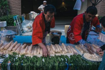 <p>Vendor arranging his produce.&nbsp;</p>