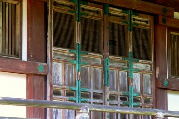 <p>The temple doors are weathered, but still beautiful</p>