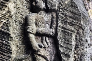 <p>This is an interesting image. I have yet to identify who it is, but note the serpent clutched in their right hand. There are some great resources online to research these topics and I encourage you to do so to get a deeper understanding of the meanings behind many of the images present at this site.</p>