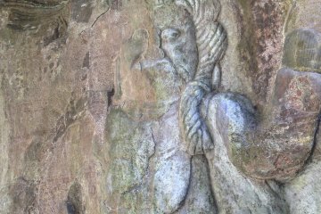 <p>A very faded image of&nbsp;Fudō Myō-ō, the immoveable&nbsp;wisdom king. He is quite prevalent at this site in both relief carvings as well as individual statues. This particular one almost bleeds into Tamonten&nbsp;(pictured earlier).</p>