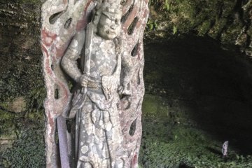<p>This is an individual statue of&nbsp;Fudō Myō-ō. This is the classic appearance in Japan. Here he is with his menacing face, ignorance-slaying sword and standing steadfast amid a wave of flames (which have Buddhist meanings regarding purification).</p>