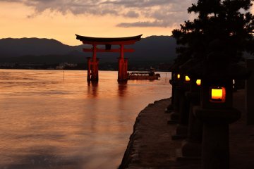 <p>The evening lanterns are now lit...soon the big torii gate will be floating on the sea</p>
