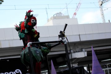 On the car floats were specially selected cosplayers to hang out and dance on the platform.