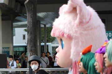 The people on the other side of the parade had to stop and wait since they weren't allowed to cross the road until the parade people did.&nbsp;