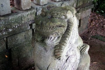 <p>Close-up look at one of the guardian dog statues</p>