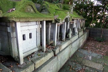 <p>Small stone shrines have mossy roofs on their heads!</p>