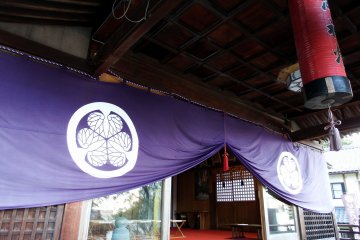 <p>Purple curtain hanging at the entrance of the prayer hall</p>