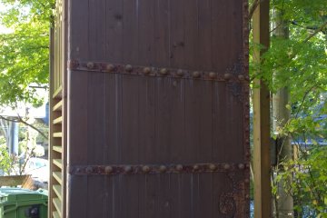 <p>The entrance is protected by a set of heavy wooden doors. &nbsp;</p>