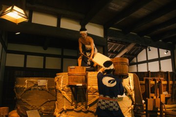 <p>Life-like models are used to depict the process of Senmai (Rice Washing)</p>