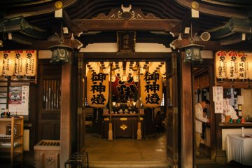 <p>A prayer is going on inside the shrine.</p>