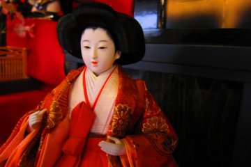 One of the larger hina dolls on display, with finely detailed features and real silk kimono