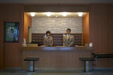 <p>The hotel manager, Toshiro Nagahama, and his lovely front desk colleague&nbsp;</p>