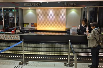 <p>The counter at Shidax. First time customer? Head to the "Reception" line.</p>